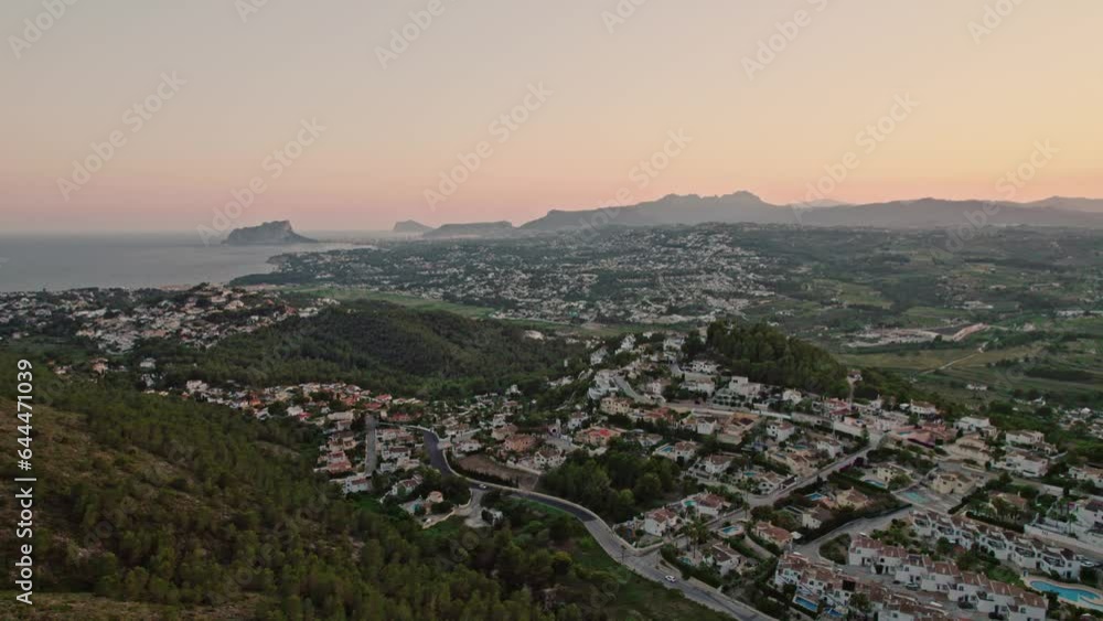 Panoramic view of a Tranquil sunset over countryside field, showcasing beauty in nature and agriculture, Zona Encinas, Cumbre del Sol, Alicante, Spain Panoramic view of a Tranquil sunset over countryside field, showcasing beauty in nature and agriculture, Zona Encinas, Cumbre del Sol, Alicante, Spain