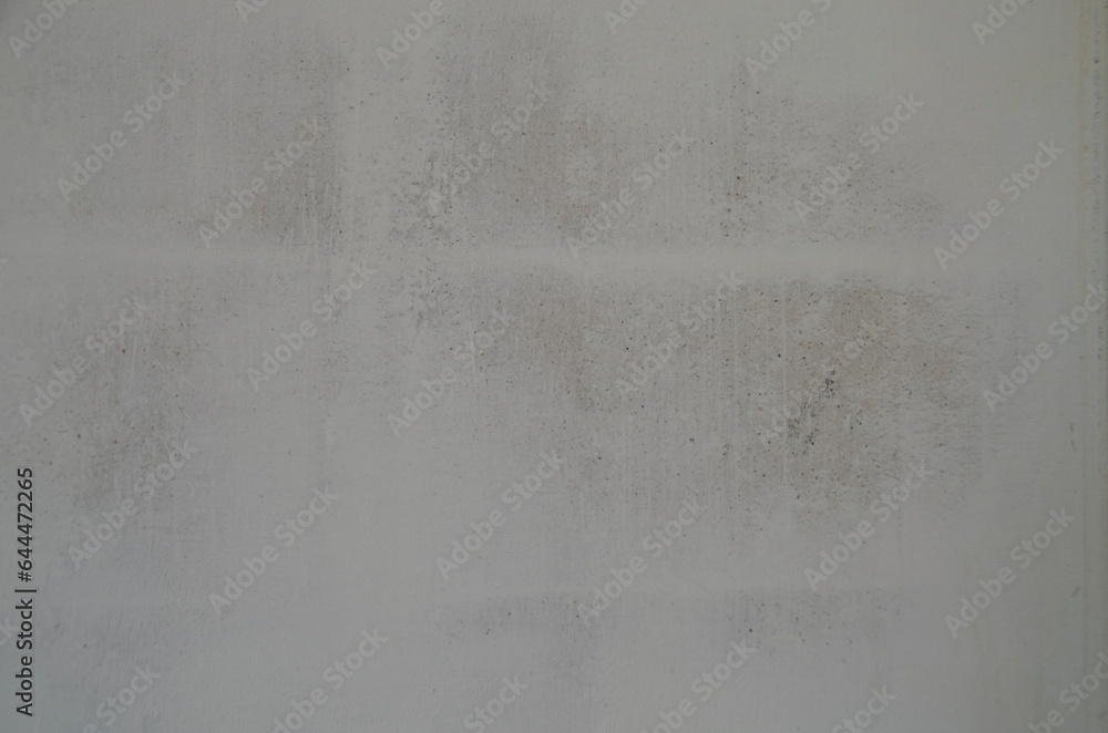 Gray background. The texture of a plastered wall in close-up. Gray background. The texture of a plastered wall in close-up.