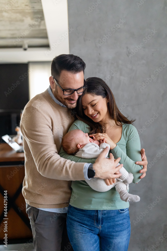 © NDABCREATIVITY - Family love parenthood baby concept. Parents spend happy moments with the newborn child © NDABCREATIVITY - Family love parenthood baby concept. Parents spend happy moments with the newborn child