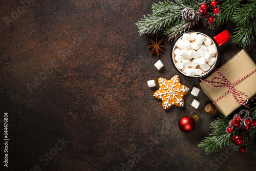 Christmas food concept. Hot chocolate, gingerbread cookies, present and holiday decorations. Top view with copy space. photo