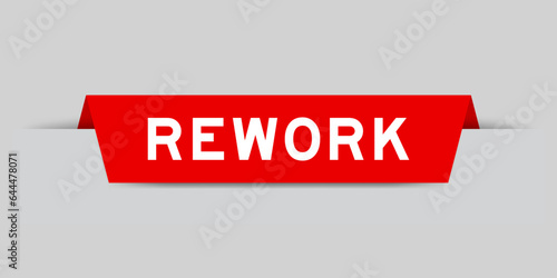 Red color inserted label with word rework on gray background