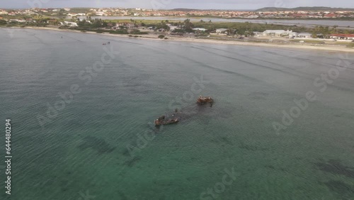 Aerial view of Baboo Shipwreck along the Arashi Beach at sunset, Noord, Aruba. photo
