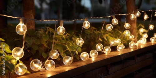 Close-up of a street garland with warm light on patio late at night. Generative AI photo