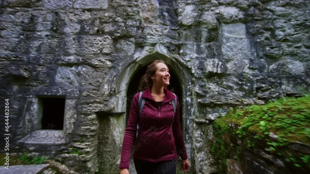 Woman Walking Out of Ireland Ruins Woman Walking Out of Ireland Ruins