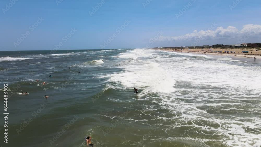 Aerial view of people doing surf at St. Augustine beach, Florida, United States. Aerial view of people doing surf at St. Augustine beach, Florida, United States.