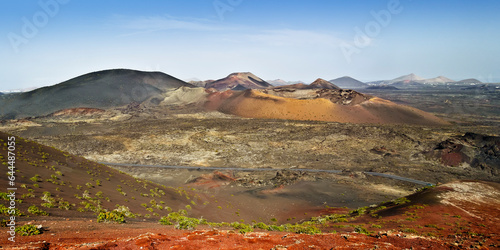 Timanfaya national park landscape of volcano craters on Lanzarote, Canary islands, Spain. Panoramic view or the popular touristic attraction.