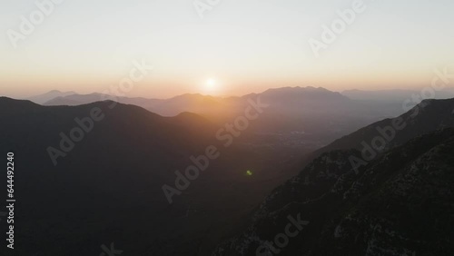 Aerial view of the sun setting down across the valley in Serino along the Mount Terminio with National park, Campania, Avellino, Italy. photo