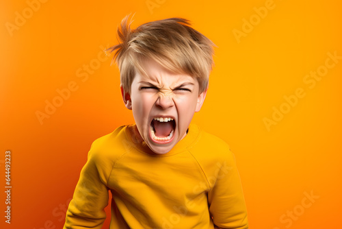 Studio portrait of a little boy being furious, isolated on colorful background. Kids emotions or moods concept. Generative AI