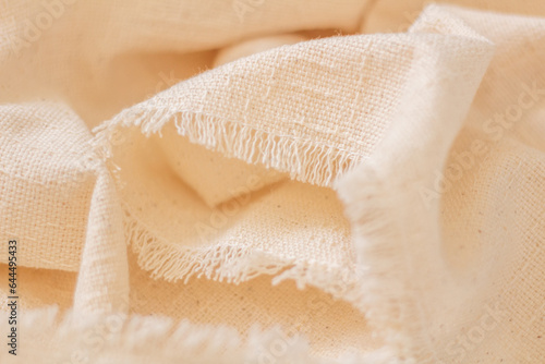 Cotton fabric closeup. Beige color.