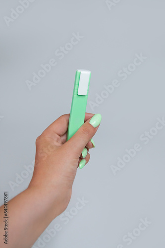 Hand holds the marker isolated on white background copy space.