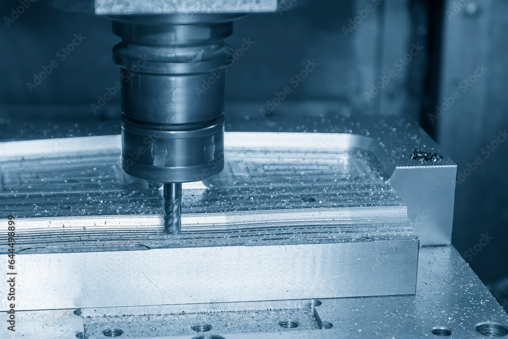 The CNC milling machine cutting press die part by solid bull end mill tool and G-code data background. The CNC milling machine cutting press die part by solid bull end mill tool and G-code data background.