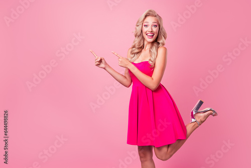 Portrait of cute slim figure astonished girl direct finger unbelievable proposition isolated on pink color background