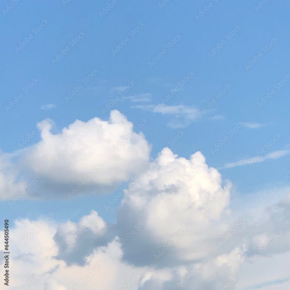 blue sky background with fluffy clouds