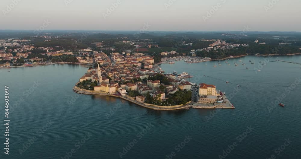 Aerial view of Porec at sunset, a small town along the Adriatic Sea coastline in Istria, Croatia. Aerial view of Porec at sunset, a small town along the Adriatic Sea coastline in Istria, Croatia.