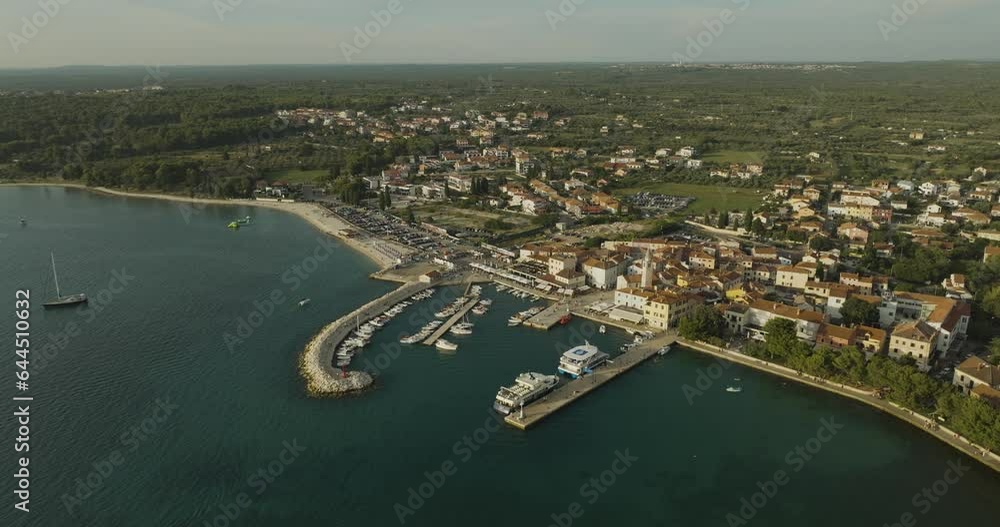 Aerial view of Fazana, a small town with a small harbour along the Adriatic Sea coastline, Istria, Croatia. Aerial view of Fazana, a small town with a small harbour along the Adriatic Sea coastline, Istria, Croatia.