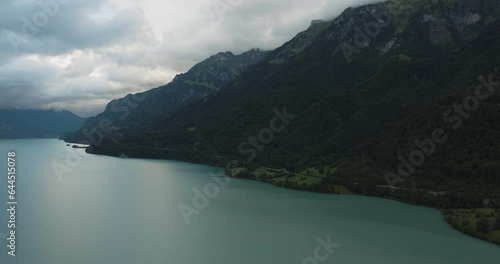 Aerial view of a road following the Brienzersee Lake coastline, Bonigen, Bern, Switzerland. photo