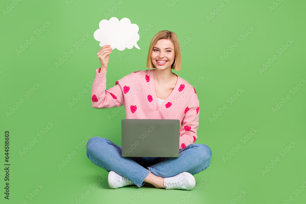 Full length photo of lovely young lady paper cloud netbook dressed stylish pink strawberry print garment isolated on green color background Full length photo of lovely young lady paper cloud netbook dressed stylish pink strawberry print garment isolated on green color background