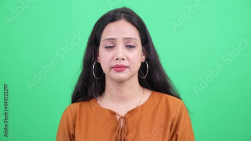 Wallpaper Mural Studio Portrait of Beautiful confident Young indian woman casually dressed ethnic woman pretty face looking at camera smiling slowly. Isolated over a green screen chroma background. Torontodigital.ca