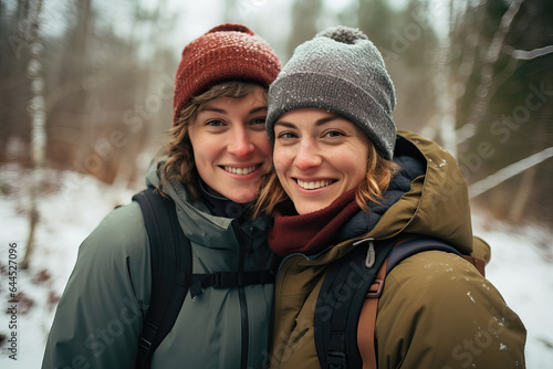 two women hiking outdoors in the snow  ai generated