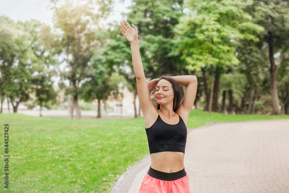 Young woman doing exercises in the park Young woman doing exercises in the park