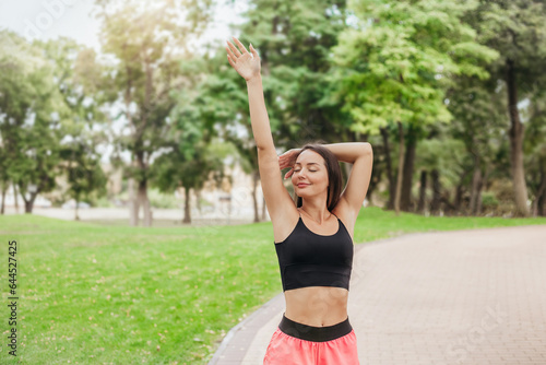 Young woman doing exercises in the park