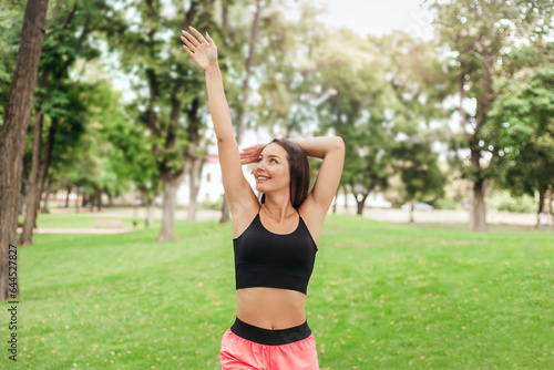 Young woman doing exercises in the park