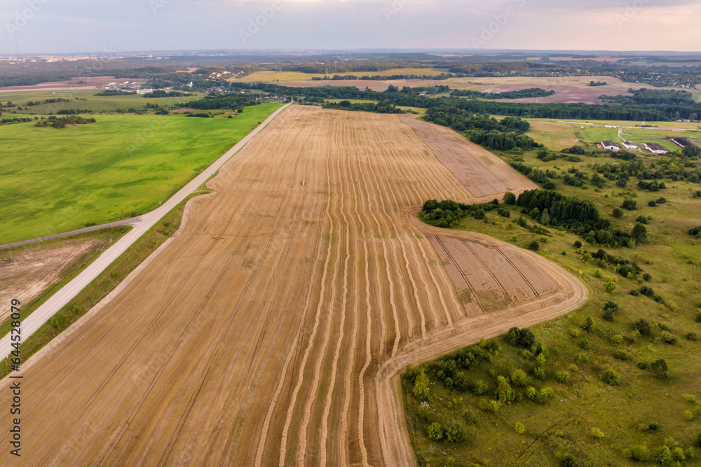 aerial panoramic view over beautiful autumn field with harvested crops is plant for green industry