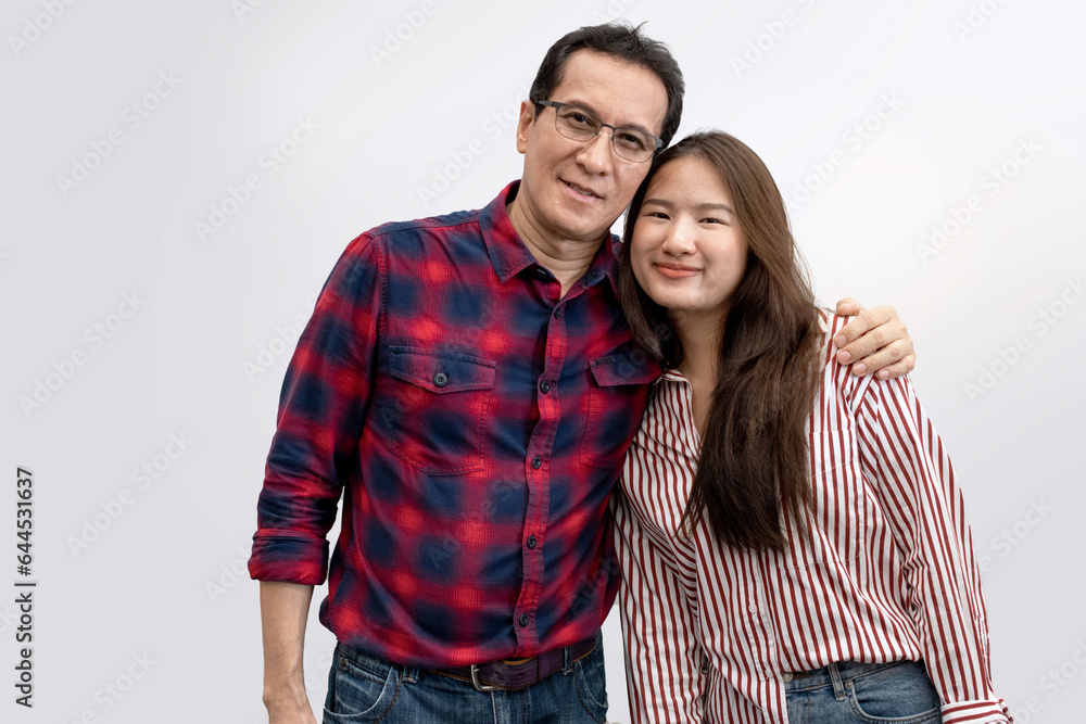Portrait of happy Asian father with young girl standing isolated over white background, Father wraps his arms around his daughter's shoulders Portrait of happy Asian father with young girl standing isolated over white background, Father wraps his arms around his daughter's shoulders