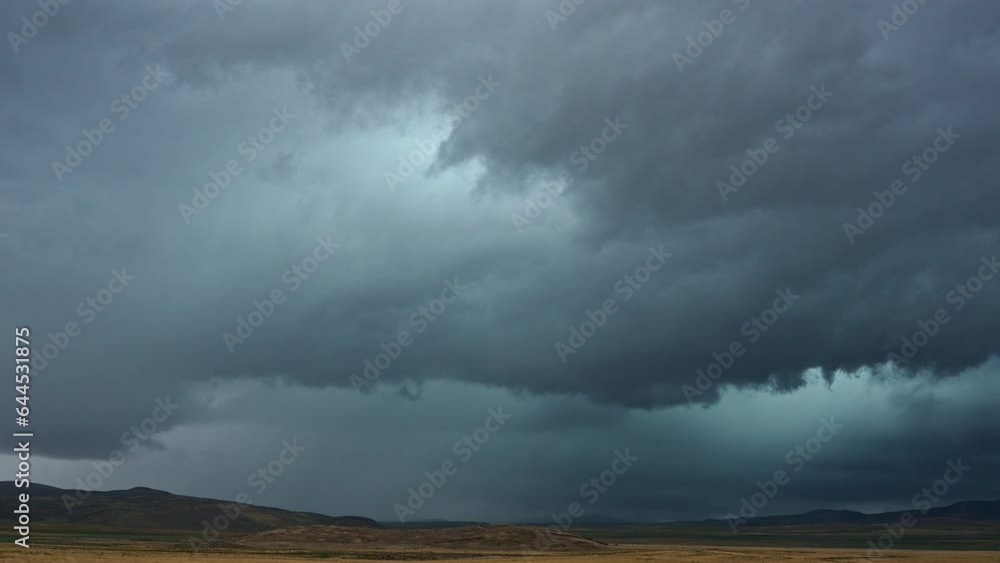 Bolt of lightning strikes the ground during summer monsoon storm in Northern Utah followed by dark clouds. Bolt of lightning strikes the ground during summer monsoon storm in Northern Utah followed by dark clouds.