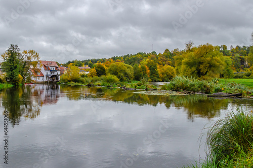 Kallmünz, Germany - River Naab in autumn with town houses in background