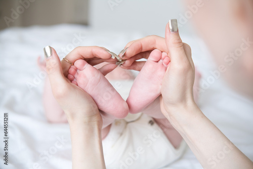 baby bare feet in mother hands. concept of Maternity