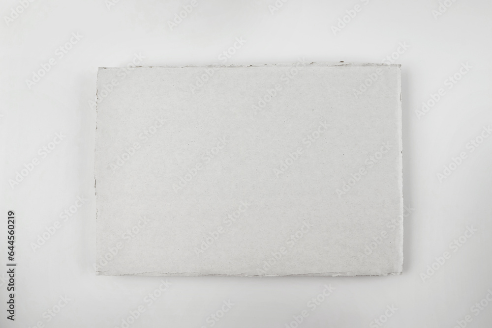 a piece of white cardboard on a white a piece of white cardboard on a white