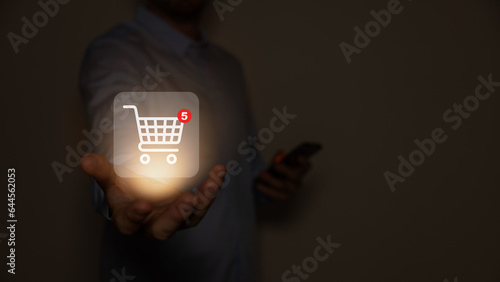 Red shopping baskets and parcel box with cart image on box float in the air above a smartphone for online shopping concept design,vector 3d isolated on orange background.