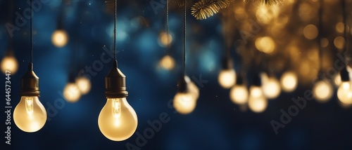 Large bulbs dangle and glow with golden light against a background of bokeh lamps and Christmas tree, wallpaper