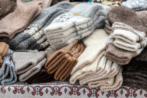 wool socks heap on market display. warm whool knitted sox in a pile close-up view
