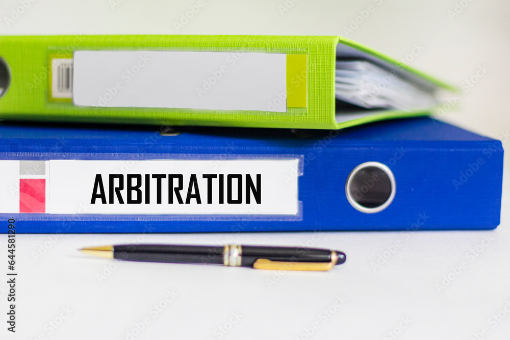 conceptual word arbitration on folder on white background conceptual word arbitration on folder on white background