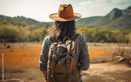Young traveler wearing a hat with backpack hiking outdoor Travel Lifestyle and Adventure concept