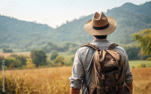 Young traveler wearing a hat with backpack hiking outdoor Travel Lifestyle and Adventure concept