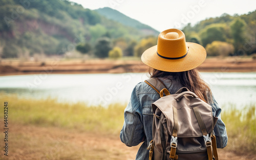 Young traveler wearing a hat with backpack hiking outdoor Travel Lifestyle and Adventure concept