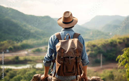 Young traveler wearing a hat with backpack hiking outdoor Travel Lifestyle and Adventure concept