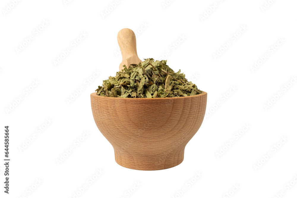 Dried leaves o Lemon verbena in latin Aloysia citrodora in wooden bowl and scoop isolated on white background. Medicinal herb. Lemon verbena leaf extract is used for its energizing and refreshing 