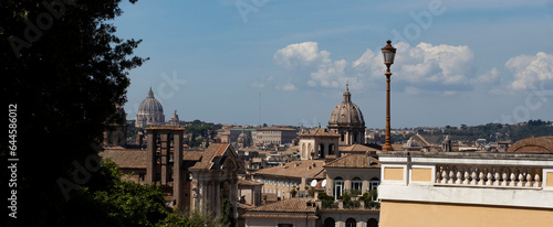 View of Rome from Piazza Caffarelli. St. Peter's Basilica, domes, churches, roofs and blue sky, banner image. photo