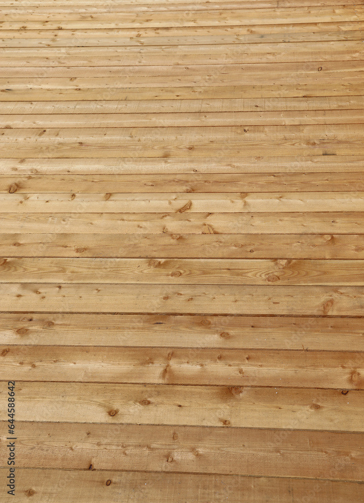 Fototapeta premium brown background of rustic rough wooden planks of a panel