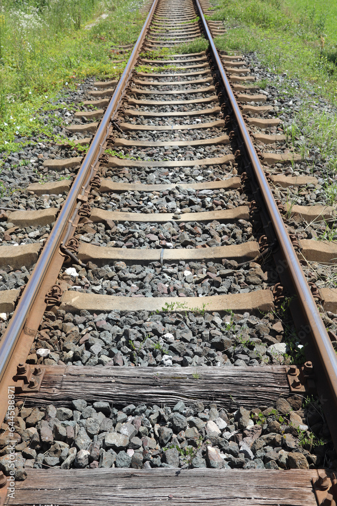 long iron train rail tracks to infinity with no people long iron train rail tracks to infinity with no people