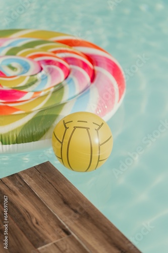 Swimming pool water texture with ball isolated.