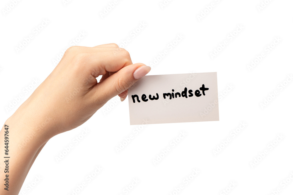 New mindset - new result text on a card in a woman hand. New mindset - new result text on a card in a woman hand.