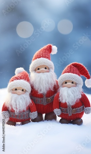 3 cute Santa get together in snow fall on blue blurred snowy forest background, concept of Merry Christmas, with copy space, Vertical. © JW Studio