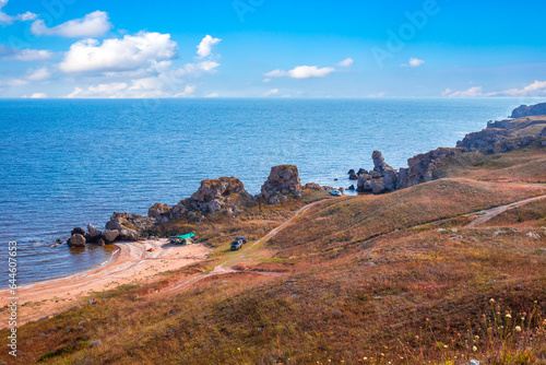 Landscape.sea coast with sandy beach and rocky shore, view from the mountain