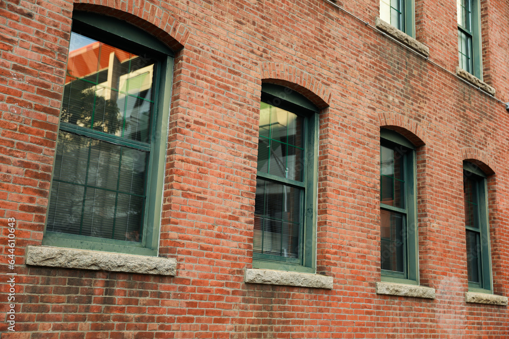 brick building in the urban skyline symbolizes real estate's enduring strength, growth, and mortgage