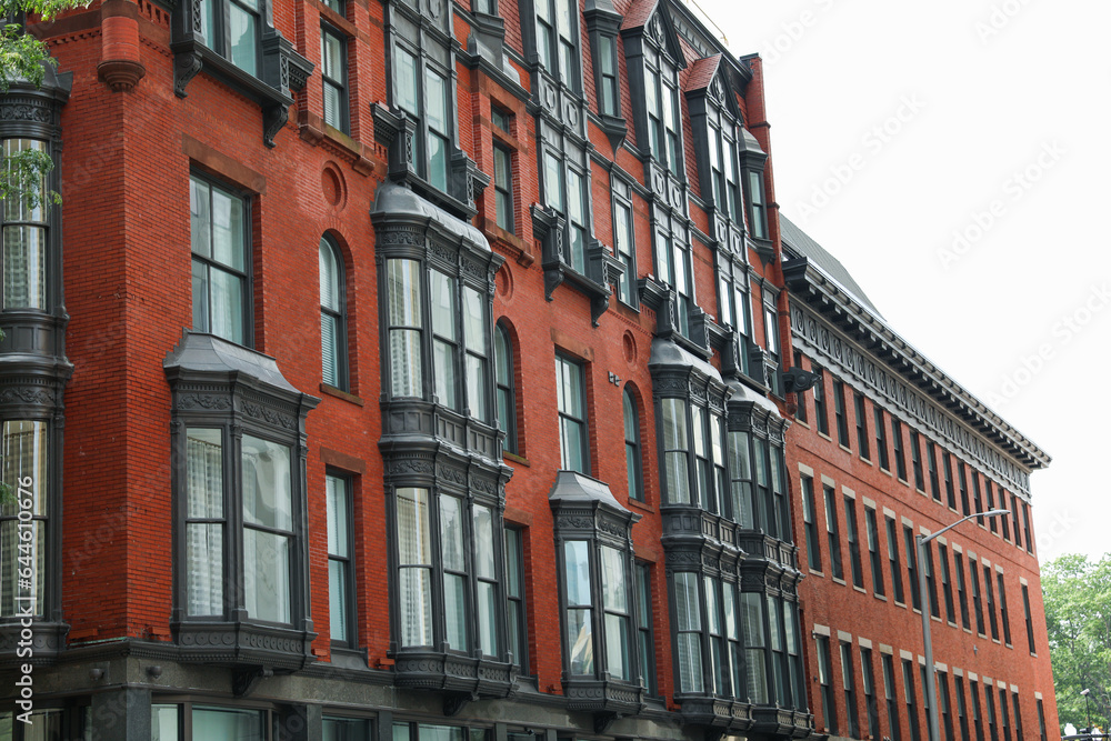 brick building in the urban skyline symbolizes real estate's enduring strength, growth, and mortgage